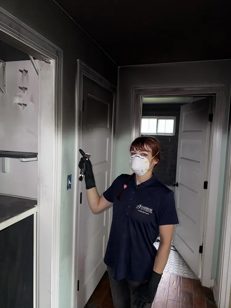 All Restoration Solutions technician in protective gear on a job in Riverside